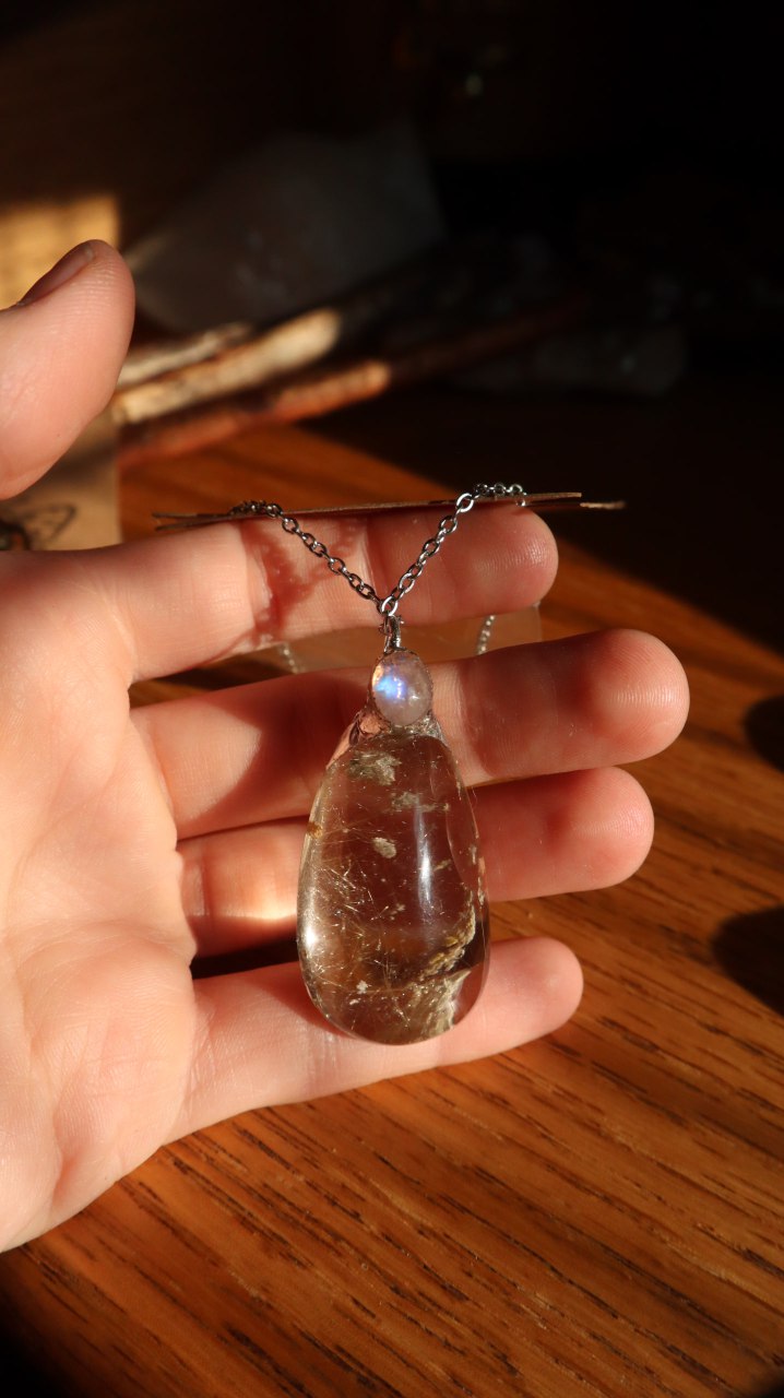 Rutilated Quartz Crystal with Moonstone Pendant